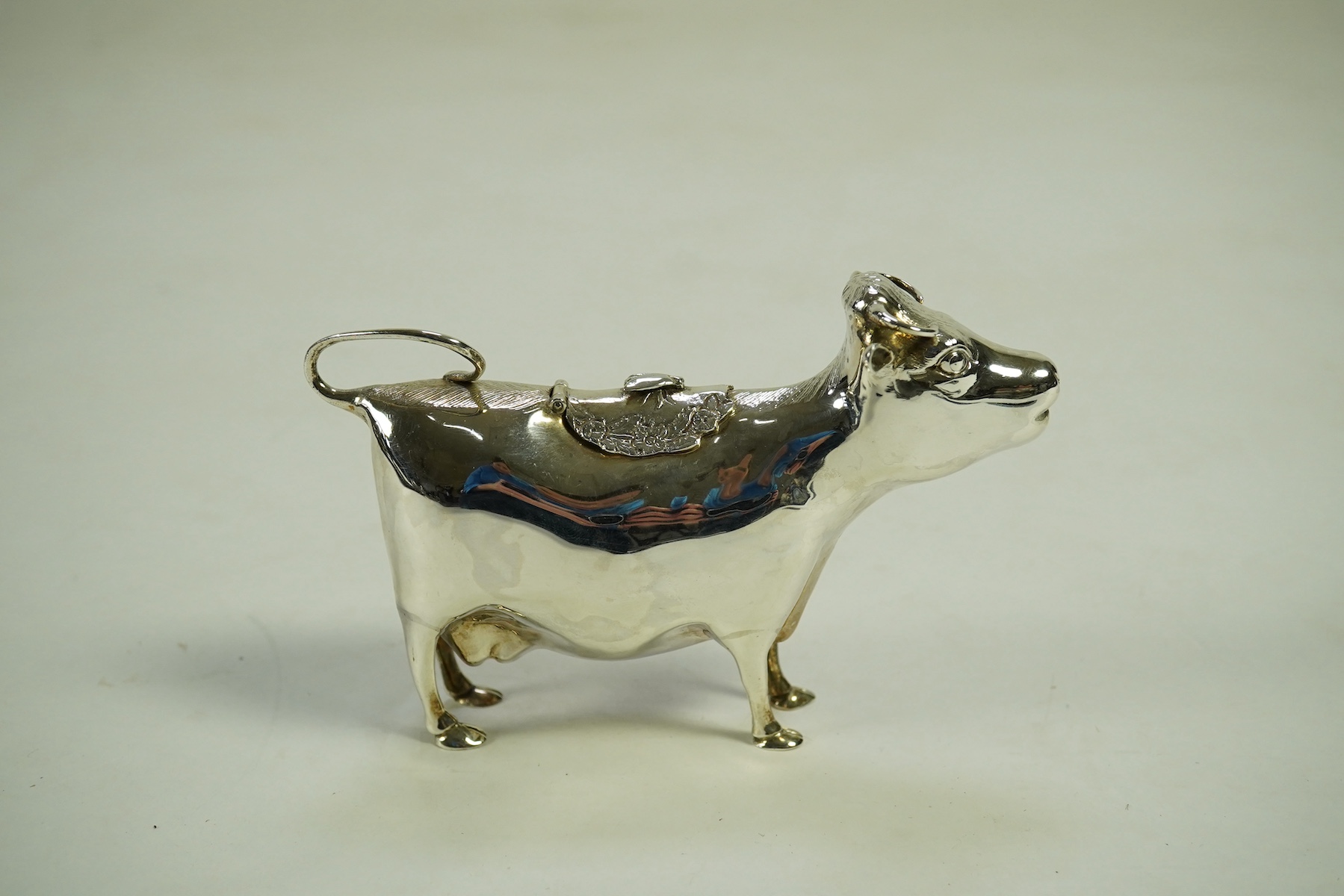 An Elizabeth II silver cow creamer by William Comyns & Sons Ltd